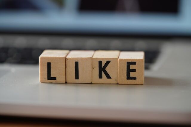 daniela-holzer-aZg78WkSDZk-unsplash | Path Social Wooden letter blocks spelling LIKE.