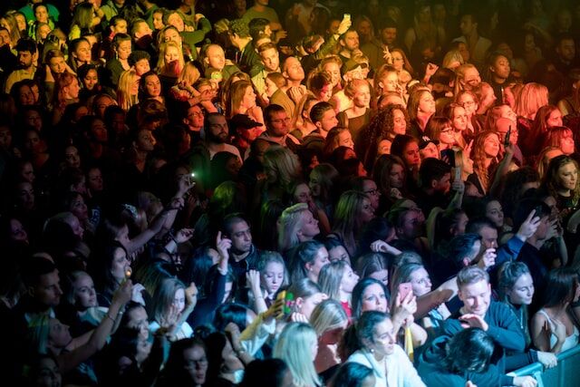 A crowd of people at a concert.