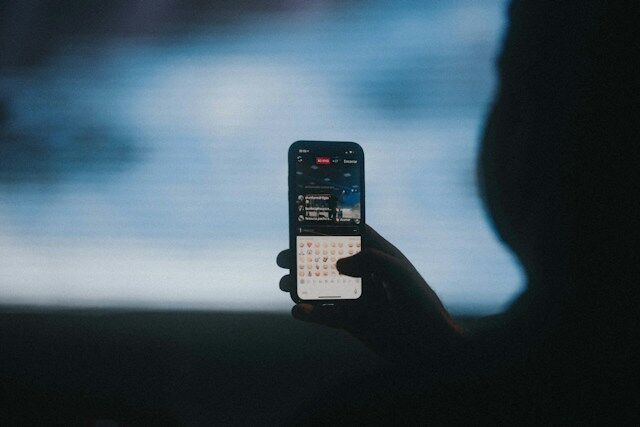 Shadowy image of a person commenting on the Instagram app.